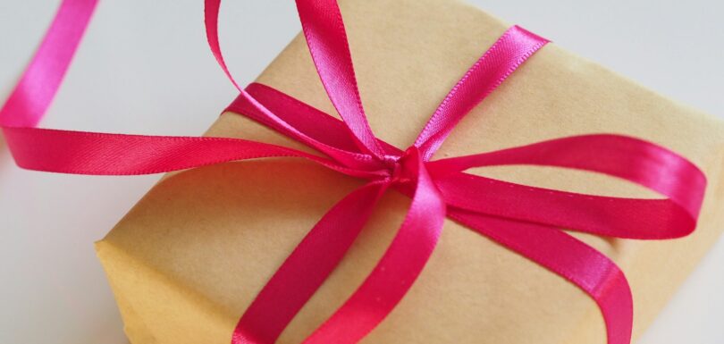 brown gift box with pink ribbon
